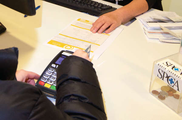 Person using eftpos in Council service centre
