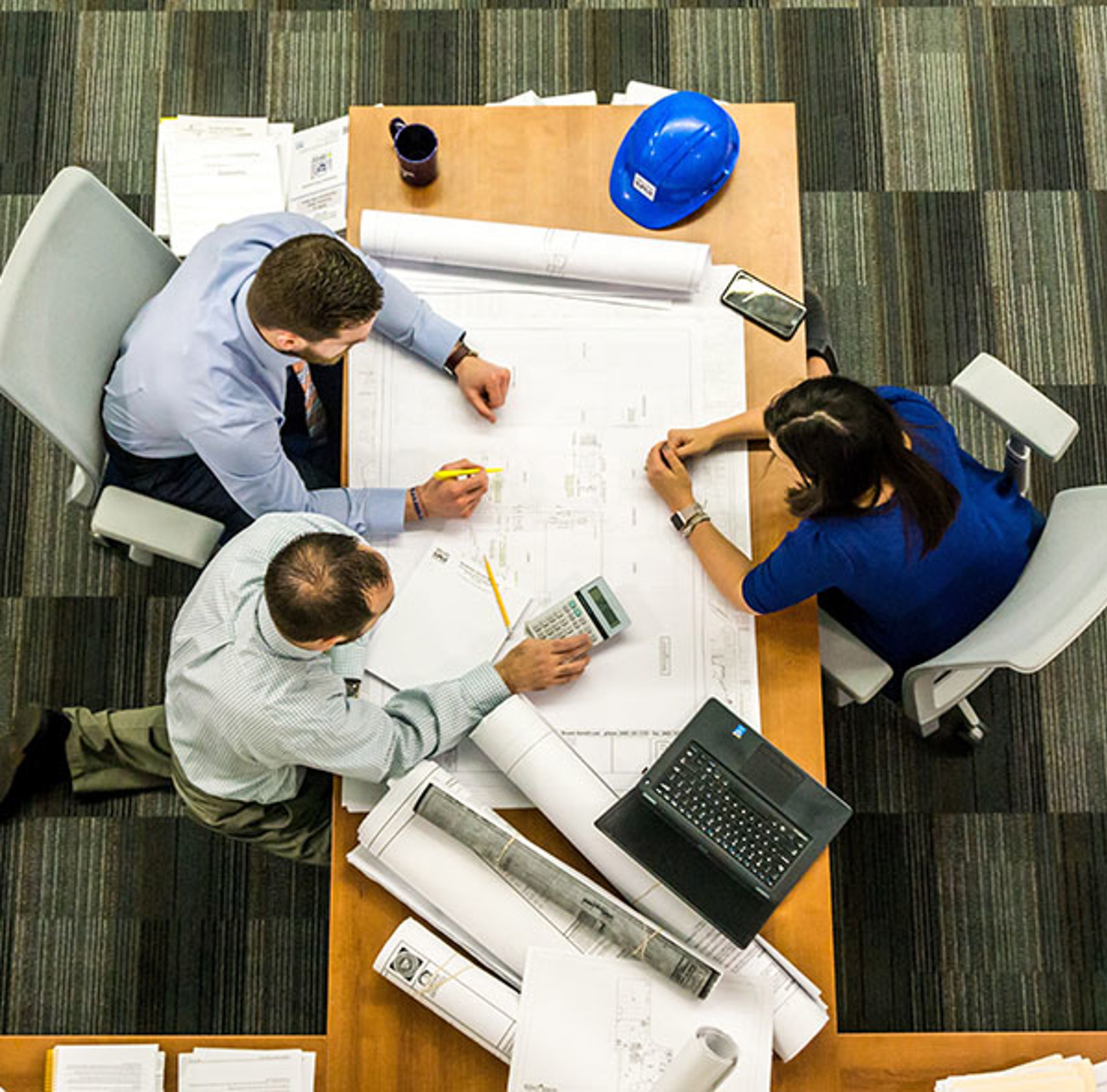 People working at an office table