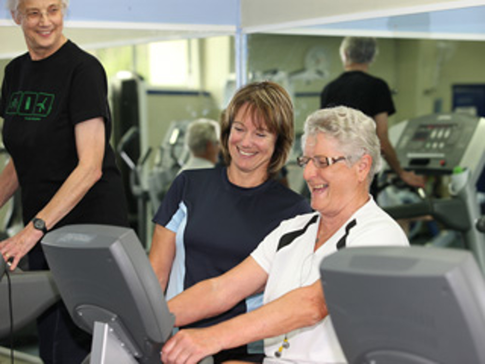 Clare working with a woman at the gym